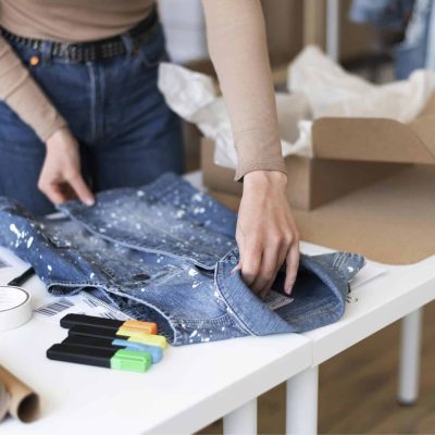 close-up-hands-folding-vest
